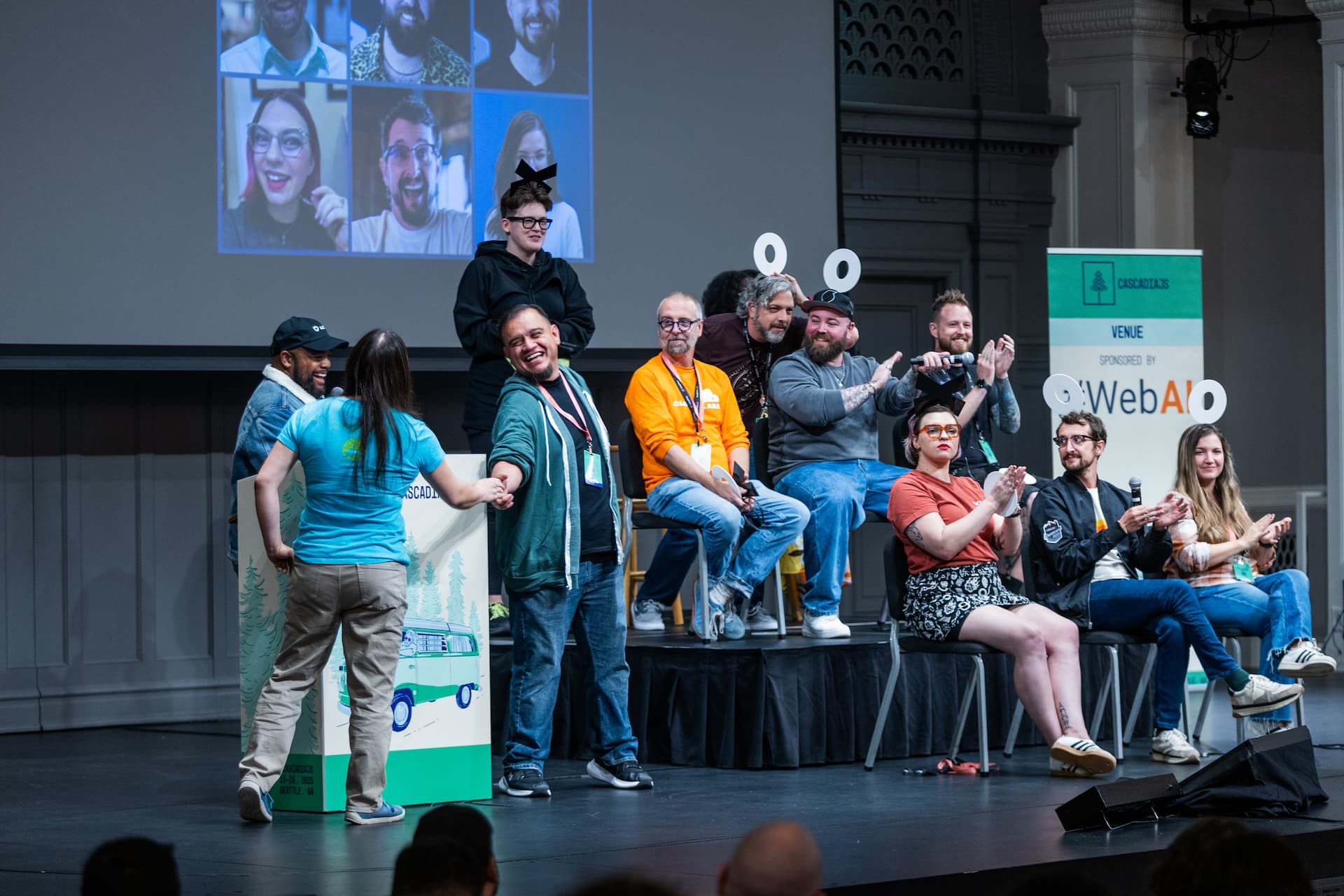 Me on stage with a group of others playing Hollywood Squares but with developers.